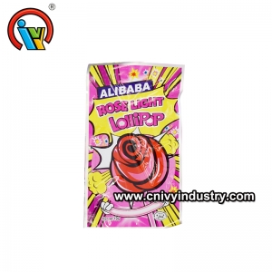 sucette à fluorescence rose avec des bonbons éclatants