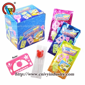 Règle de jouet avec des bonbons de sucette pour les enfants