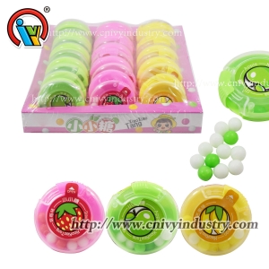 Bonbons durs aux fruits à l'intérieur de la bouteille à couvercle coulissant