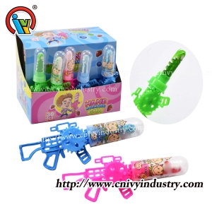 forme de pistolet secouant la main jouet rotatif sucette bonbon